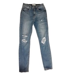 Distressed light wash blue skinny jeans